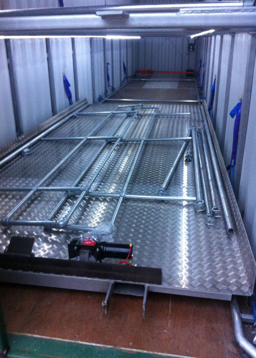 Container with loading cradle for car transport